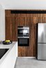 Modern home with Kitchen, Wood Cabinet, Porcelain Tile Floor, Engineered Quartz Counter, Microwave, Refrigerator, Wall Oven, and White Cabinet. Kitchen Photo 11 of MG House