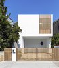 Modern home with Exterior, Concrete Siding Material, Glass Siding Material, Beach House Building Type, House Building Type, and Flat RoofLine. Custom rosewood gates and privacy screens at the street entrance. Unsealed, these will grey naturally over time. Photo 2 of Cloud House