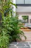 Modern home with Outdoor, Side Yard, Pavers Patio, Porch, Deck, Trees, Wood Patio, Porch, Deck, Shrubs, Hardscapes, Walkways, and Landscape Lighting. The internal courtyard captures northerly light. Photo 14 of Cloud House