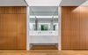Modern home with Bath Room, Marble Counter, Medium Hardwood Floor, Ceiling Lighting, Drop In Sink, and Marble Wall. Master En Suite with Carrara marble surfaces. Photo 10 of Cloud House