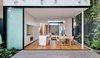 Modern home with Dining Room, Ceiling Lighting, Pendant Lighting, Medium Hardwood Floor, Table, and Chair. The rear garden looks into the kitchen and dining space right through the internal courtyard and beyond. Photo 20 of Cloud House