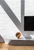 Modern home with Living Room, Medium Hardwood Floor, and Floor Lighting. Living space detail featuring the Henry Wilson Surface Sconce. Photo 4 of Cloud House