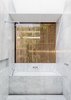 Modern home with Bath Room, Marble Counter, Soaking Tub, Marble Floor, One Piece Toilet, Open Shower, Marble Wall, and Ceiling Lighting. Custom Rosewood screens create privacy. Photo 8 of Cloud House