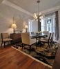 Modern home with Dining Room, Medium Hardwood Floor, Table Lighting, Chair, Ceiling Lighting, Lamps, Recessed Lighting, and Table. Michael Molesky Interior Design. Modern dining room in a DC townhouse. Rich textures of the art and chair velvets bring this monochromatic room to life. Photo of Historic Townhouse Made Modern