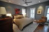 Modern home with Bedroom, Table Lighting, Dresser, Bed, Night Stands, Medium Hardwood Floor, Chair, Recessed Lighting, and Ceiling Lighting. Michael Molesky Interior Design. Modern guest bedroom in a DC townhouse. New bedding, beside tables, lamps and rug were brought in to compliment the client's existing bed and dresser. Photo 10 of Historic Townhouse Made Modern