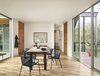 Modern home with Dining Room, Medium Hardwood Floor, Table, Recessed Lighting, Wall Lighting, Chair, Ceiling Lighting, and Storage. View of dining area and outdoor porch in the trees by Low Design Office Photo 4 of Guadalupe River House