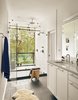 Modern home with Bath Room, Engineered Quartz Counter, Undermount Sink, Wall Lighting, Recessed Lighting, Full Shower, Subway Tile Wall, Open Shower, Porcelain Tile Wall, Ceiling Lighting, and Porcelain Tile Floor. View of outdoor shower and Guadalupe River from master bathroom by Low Design Office Photo 7 of Guadalupe River House