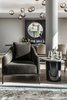 Modern home with Living Room, Chair, Console Tables, Pendant Lighting, and Light Hardwood Floor. “We used subtle shades of green with delicate natural tonalities that reference the local landscape,” says Court. Table Mountain’s famous granite, fynbos and dappled woods are evoked throughout the apartment in a rich, raw palette of natural timbers, stones and metals, which are contrasted with plush velvets and linens on the walls, floors and furniture coverings, resulting in what Court refers to as a contemporary “quiet opulence”. Photo 3 of Clifton 301