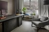 Modern home with Office, Study Room Type, Lamps, Shelves, Chair, and Desk. The GT timber armchair is a classic and softens the mood in the study which is outfitted with custom desk, She standing lamp and accessories, all by OKHA. Photo 10 of Clifton 301