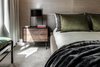 the second bedroom has a custom bed and Frame Flat table lamp both by OKHA. Photo 12 of Clifton 301 modern home