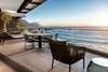 Modern home with Exterior and Apartment Building Type. “The panoramic exterior allows you to feel as though you are hovering right above the water’s surface.” Photo 13 of Clifton 301