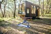 Modern home with Outdoor, Trees, Decomposed Granite Patio, Porch, Deck, Woodland, Slope, Grass, Landscape Lighting, Field, and Shrubs. Escape with nature. Photo 2 of CABN