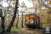 Modern home with Exterior, Metal Siding Material, Small Home Building Type, Wood Siding Material, Flat RoofLine, Tiny Home Building Type, and Metal Roof Material. A self sustainable, eco friendly, Australian made tiny home. Photo 9 of CABN