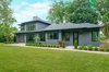 Modern home with Exterior, House Building Type, Wood Siding Material, and Shingles Roof Material. Dorchester Back Exterior Photo 3 of The Dorchester Project by Paul + Jo Studio
