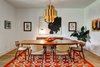 Modern home with Dining Room, Accent Lighting, Lamps, Table, Light Hardwood Floor, Chair, Table Lighting, Ceiling Lighting, and Storage. Dorchester Interior Dining Room Photo 7 of The Dorchester Project by Paul + Jo Studio