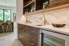 Modern home with Ceiling Lighting and Light Hardwood Floor. Dorchester Interior Bar/Butlers Pantry Photo 15 of The Dorchester Project by Paul + Jo Studio