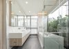 Modern home with Engineered Quartz Counter, Ceiling Lighting, Porcelain Tile Floor, and Undermount Sink. View of master bath 1 Photo 15 of SIRI House
