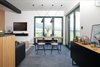 Modern home with Dining Room, Pendant Lighting, Bench, Chair, Ceramic Tile Floor, Table, Stools, and Lamps. apartment offers beautiful views on mountains, dining chairs are iconic Wire chair from Vitra, design Charles and Ray Eames Photo 4 of Mountain Apartment in Ore Mountain, Czech Republic