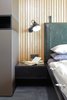 Modern home with Wall Lighting and Ceramic Tile Floor. detail of custom designed headboard made from green vintage leather Photo 12 of Mountain Apartment in Ore Mountain, Czech Republic