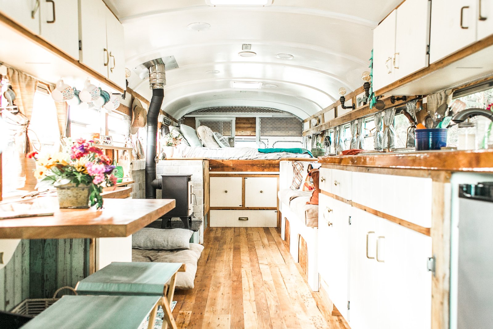 View from the driver's area looking back. Our floor is reclaimed factory maple from a textile mill in MA. It's rustic, worn, entirely imperfect and we love it. We used every board foot of it on the face frames, wall trim, etc.