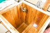 Modern home with Medium Hardwood Floor, Wood Counter, and Accent Lighting. Our shower/tub. This photo was taken just before we completed the final touches to our reclaimed southern yellow pine tub basin. It now has a drain & shower head/wand. Southern yellow pine is a naturally sappy wood, this is why we chose it. After sealing seams and glazing with a few coats of a two-part mirror coat, it's perfect! We love that it's a little different, custom, it's us. Photo 12 of The Wild Drive Life Bus