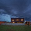 Modern home with Windows, Wood, and Sliding Window Type. Nocturnal view of the brise-soleil facade. Photo 10 of QP House