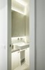Modern home with Bath Room, Ceramic Tile Floor, One Piece Toilet, Concrete Counter, Concrete Wall, Vessel Sink, and Recessed Lighting. Small white bathroom Photo of remodelled duplex in a contemporary style