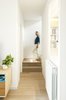 Modern home with Staircase, Concrete Tread, and Wood Railing. common area with wood floor Photo 6 of remodelled duplex in a contemporary style
