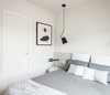 Modern home with Bedroom, Bed, Pendant Lighting, and Light Hardwood Floor. Double bedroom in white and grey colors Photo 10 of remodelled duplex in a contemporary style
