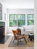Modern home with Living Room, Ceiling Lighting, Chair, Light Hardwood Floor, and Standard Layout Fireplace. Living 01 Photo 7 of New Canaan Home