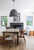 Modern home with Dining Room, Chair, Bench, Table, Pendant Lighting, Light Hardwood Floor, and Standard Layout Fireplace. Living / Dining Photo 9 of New Canaan Home