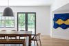 Modern home with Dining Room, Table, Bench, Light Hardwood Floor, Chair, and Pendant Lighting. Dining Photo 10 of New Canaan Home
