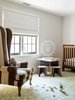 Modern home with Ceiling Lighting, Light Hardwood Floor, and Chair. Baby Room 02 Photo 16 of New Canaan Home