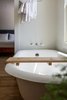 Modern home with Bath Room, Light Hardwood Floor, Ceiling Lighting, Pedestal Sink, and Two Piece Toilet. Master bath upstairs attached to master bed with authentic clawfoot soaking tub Photo 12 of Modern Farmhouse