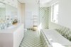 Modern home with Bath Room, Ceramic Tile Floor, Wall Lighting, Drop In Sink, Ceramic Tile Wall, Soaking Tub, Engineered Quartz Counter, Undermount Tub, Enclosed Shower, Full Shower, and Drop In Tub. The pastel tiles used by Atelier Starzak Strebicki bring a calming mood to the washroom. Photo 9 of Apartment with a view