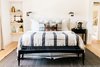 Modern home with Bedroom, Bookcase, Storage, Bench, Shelves, Night Stands, Ceiling Lighting, Dresser, Bed, and Light Hardwood Floor. Downstairs master bedroom Photo 3 of Brand New Renovation, Designer Furnishings Near Laguna Main Beach & Village