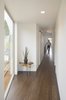 Modern home with Hallway, Dark Hardwood Floor, and Bamboo Floor. The 2nd floor corridor creates a light-filled axial connection to all 4 bedrooms and their amenities. Photo 9 of Farwell