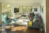 Modern home with Living Room, Sectional, Chair, Coffee Tables, Recliner, Ottomans, Sofa, Recessed Lighting, Console Tables, Dark Hardwood Floor, Gas Burning Fireplace, Bamboo Floor, and Rug Floor. Living room from front door framing the landscape. Photo 4 of Farwell