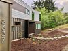 Modern home with Exterior, House Building Type, Wood Siding Material, Flat RoofLine, Metal Siding Material, Concrete Siding Material, and Tile Roof Material. The entry portal shows itself to the public. Photo 19 of Farwell
