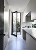 Modern home with Laundry Room, Laminate Cabinet, Stone Counter, and Concealed. Canny 'The New' Laundry Photo 4 of The New
