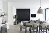 Modern home with Living Room, Standard Layout Fireplace, Chair, Pendant Lighting, Light Hardwood Floor, Shelves, Sofa, and Ceiling Lighting. Canny 'The New' Dining / Living Photo 15 of The New