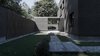 Modern home with Exterior, Brick Siding Material, House Building Type, Wood Siding Material, Flat RoofLine, and Shingles Roof Material. Hide&Seek Game. Location of the windows and their size is not designer’s imagination. Photo 5 of The Grey House