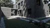 Modern home with Windows, Single Hung Window Type, Masonite, and Metal. To say more precisely, something was disturbing it. Before the final version of Grey House there was a pretty banal skeleton with small symmetrical window frames. Photo 6 of The Grey House