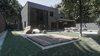 Modern home with Exterior, Shingles Roof Material, Wood Siding Material, House Building Type, Brick Siding Material, and Flat RoofLine. It is important to look at any situation from a different perspective. Photo 10 of The Grey House