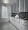 Modern home with Laundry Room, Engineered Quartz Counter, Side-by-Side, and Wood Cabinet. Laundry Room Photo 9 of Contemporary Michigan Lake Home