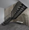 Modern home with Staircase, Metal Railing, Wood Tread, and Metal Tread. The stairs in this 2017 Franklin home seemingly float on a frame tubular steel, painted black, in front of the 20’ floor to ceiling limestone wall. The only supports on the staircase other than the top and bottom are where the landing attaches to the front wall. Treads and landing are rift cut white oak stained to match the entry door. The simple linear rail was crafted from rectangular bar stock and tube stock. The open design allows light from the main floor to flood the opening. The lower level features a stone-like luxury vinyl flooring that was selected for it’s warm look and feel and because it is easier under foot than concrete or ceramic tile. Photo 14 of Contemporary Michigan Lake Home