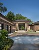 Completed in 2017, this home in Franklin, inspired by the Frank Lloyd Wright Robie House in Chicago features large overhangs and a shallow sloped hip roof. The exterior features long pieces of Indiana split-faced limestone in varying heights and elongated norman brick with horizontal raked joints and vertical flush joints to further emphasize the linear theme. The courtyard features a combination of exposed aggregate and saw-cut concrete while the entry steps are porcelain tile. The siding and fascia are wire-brushed African mahogany with a smooth mahogany reveal between boards.
Photo 18 of Contemporary Michigan Lake Home modern home