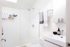 Modern home with Ceiling Lighting and Concrete Floor. The bathroom is bright, clean and beautiful - everything you want a bathroom to be. Photo 13 of 111 House