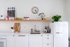 Modern home with Kitchen, Open Cabinet, Engineered Quartz Counter, Range, Dishwasher, Microwave, Refrigerator, Undermount Sink, White Cabinet, Concrete Floor, and Wood Cabinet. 111 House kitchen. Photo 8 of 111 House