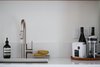 Modern home with Kitchen, Undermount Sink, Stone Slab Backsplashe, and Engineered Quartz Counter. 111 House kitchen. Heart coffee is only 2 blocks so it's easy to buy beans or just have them make your coffee for you! Photo 9 of 111 House